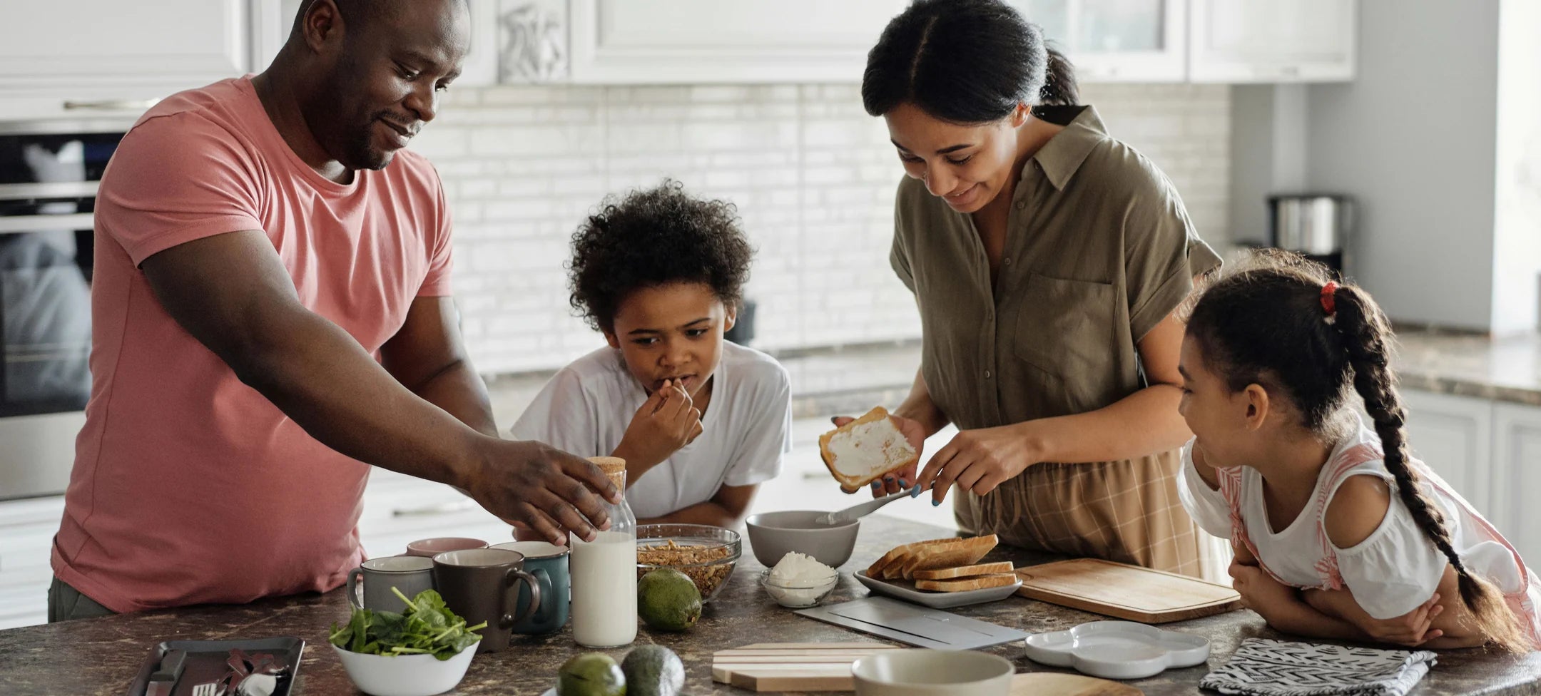 Family sharing breakfast in a bright home kitchen