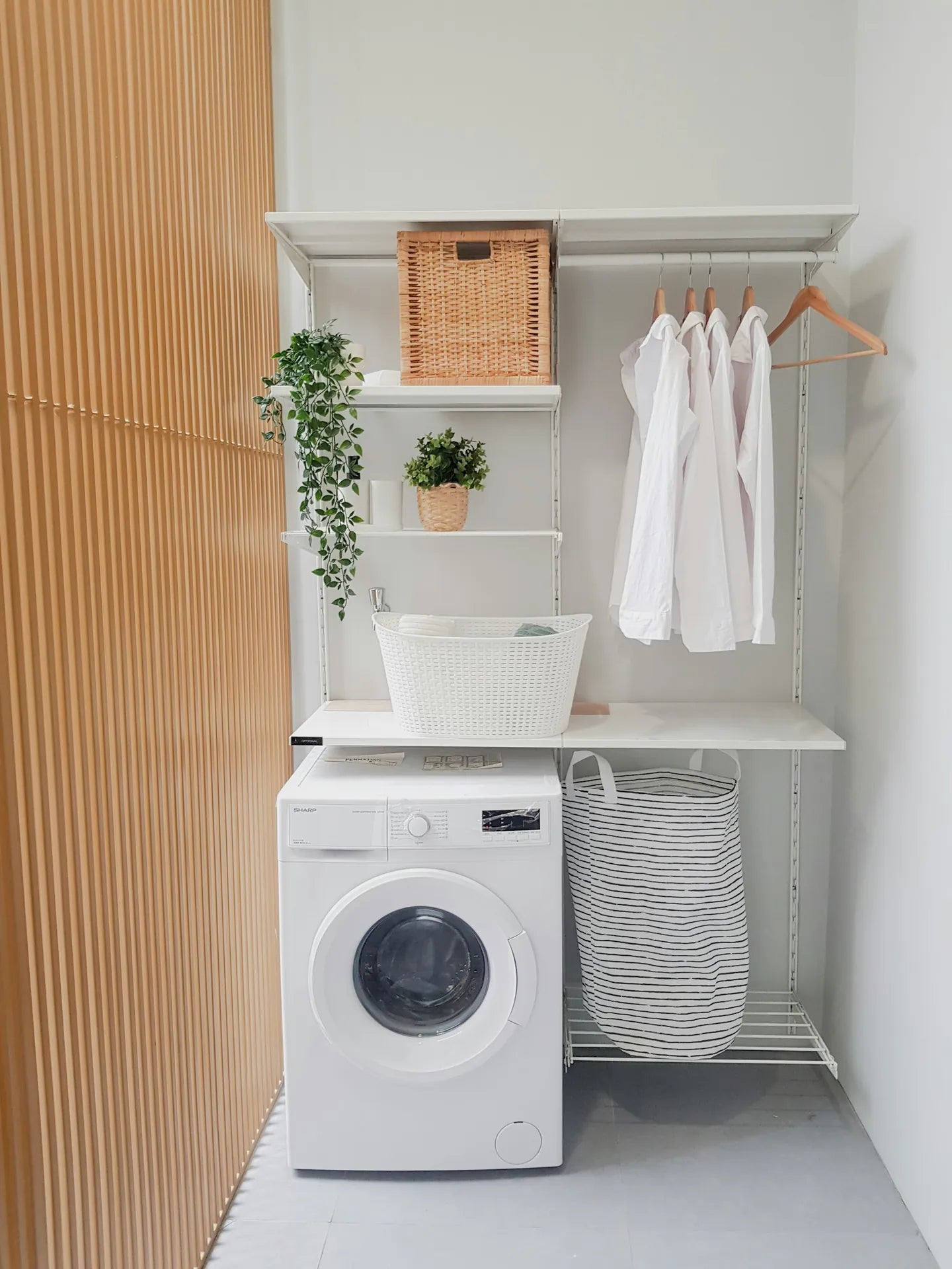Laundry space organized with baskets and everyday storage